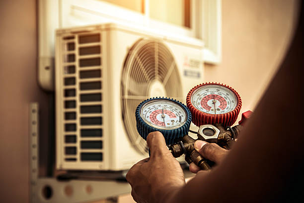 Professional Heat Pump Repair technician working in Methuen, MA